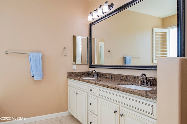 bathroom with tile patterned flooring and vanity