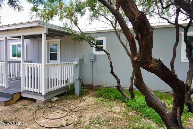 view of side of property with metal roof