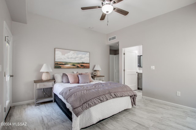 bedroom with a ceiling fan, visible vents, ensuite bath, and baseboards