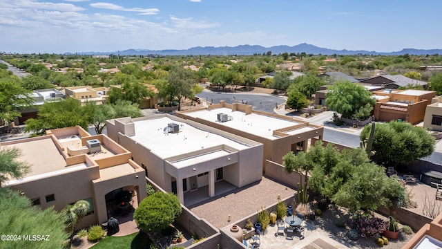 drone / aerial view featuring a residential view and a mountain view