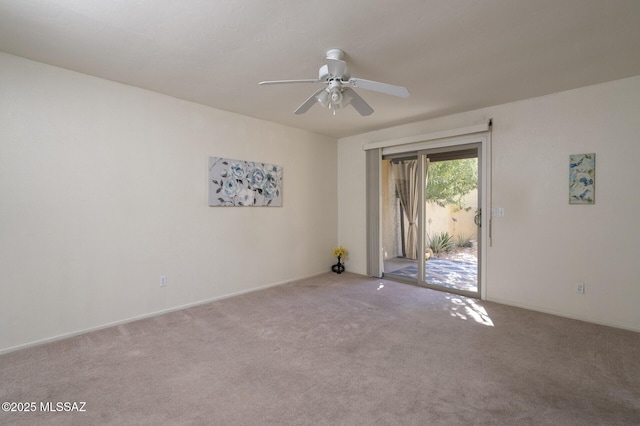 spare room featuring ceiling fan and light colored carpet