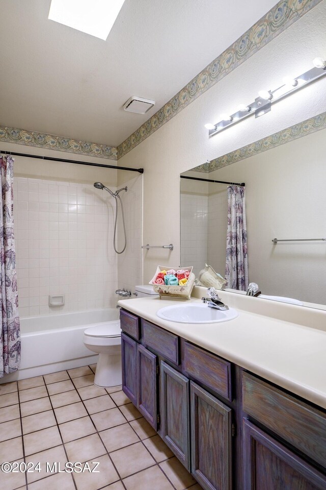 full bathroom featuring tile patterned flooring, vanity, shower / bath combination with curtain, and toilet