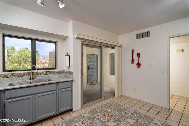 interior space featuring tile patterned floors and sink