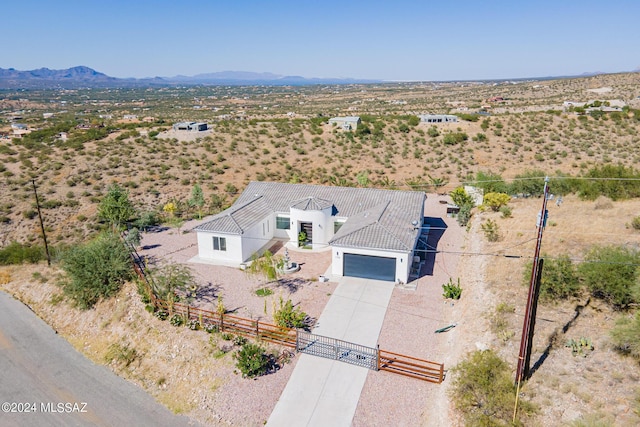 aerial view featuring a mountain view and view of desert