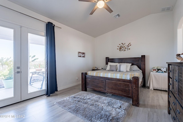 bedroom featuring lofted ceiling, access to outside, visible vents, and french doors