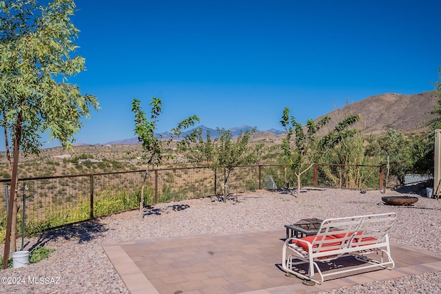 view of patio featuring a fenced backyard and a mountain view