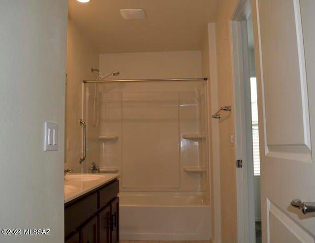 bathroom with vanity and  shower combination