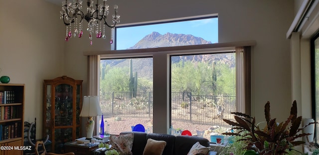 interior space featuring a mountain view and a notable chandelier