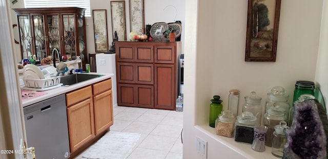 bar with a sink, dishwashing machine, and light tile patterned floors