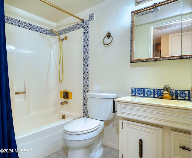 full bathroom featuring shower / bath combo with shower curtain, tile patterned floors, vanity, and toilet