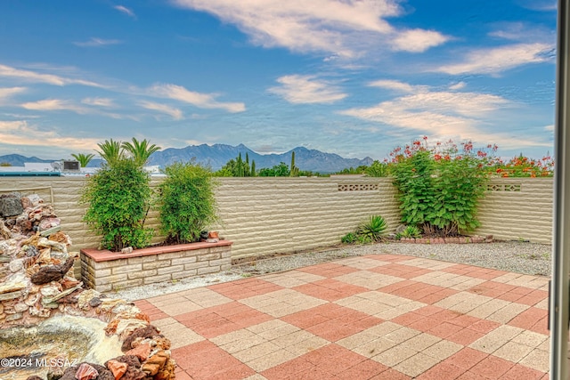 view of patio / terrace with a mountain view