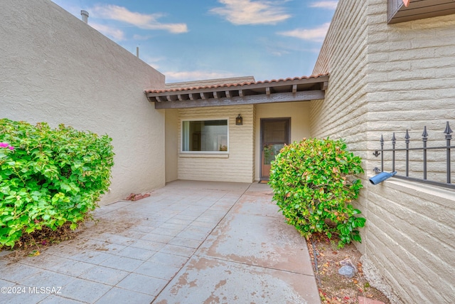 doorway to property featuring a patio area