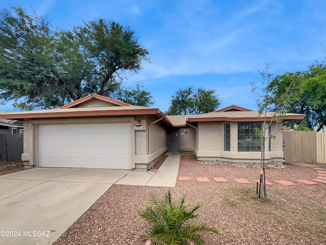 single story home featuring a garage