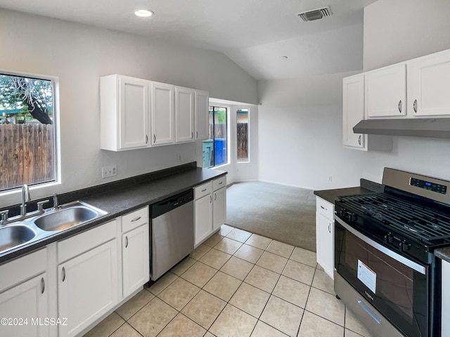 kitchen featuring appliances with stainless steel finishes, light tile patterned floors, sink, and a wealth of natural light