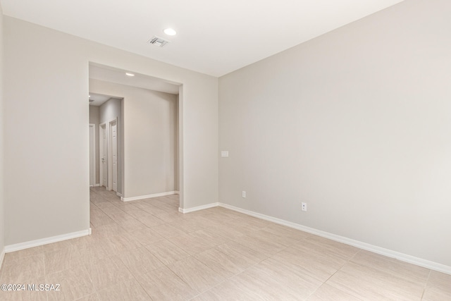 spare room featuring light tile patterned floors