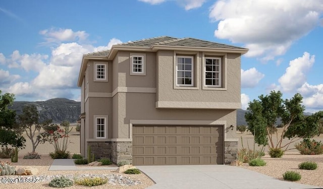 view of front facade with a mountain view and a garage