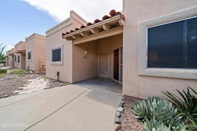 doorway to property with a patio