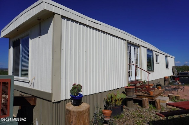 view of property exterior featuring a patio area