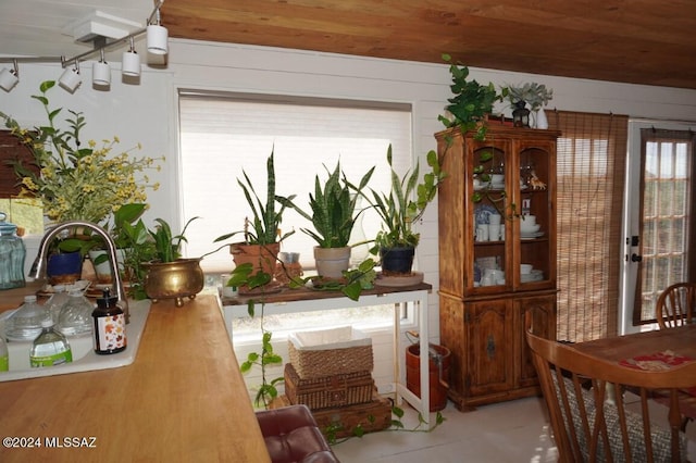 dining space with wooden ceiling