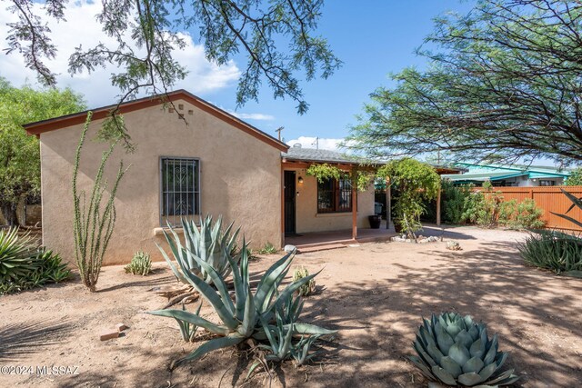 back of house with a patio area