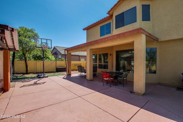 view of patio / terrace with outdoor dining space and fence