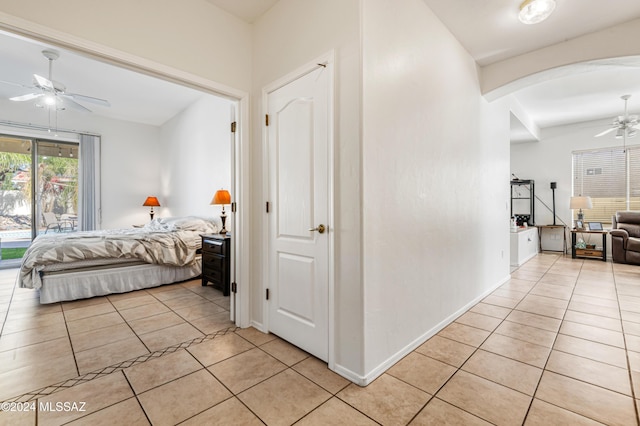 bedroom featuring ceiling fan and light tile patterned flooring