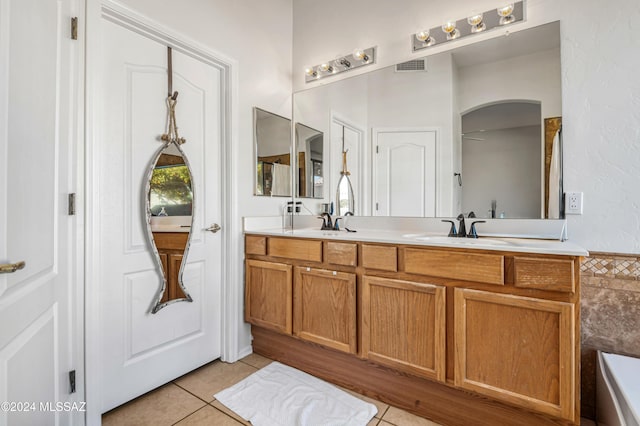 bathroom with tile patterned flooring and vanity