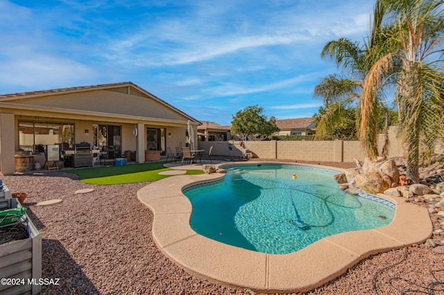 view of swimming pool with a patio