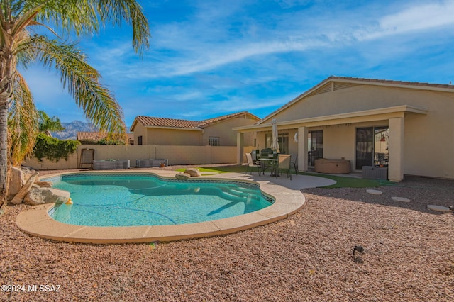 view of swimming pool with a patio area