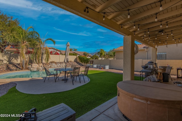 view of yard with a fenced in pool and a patio area