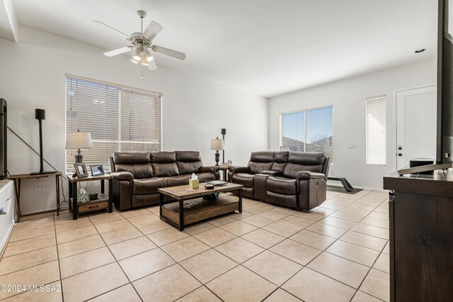 living room with ceiling fan and light tile patterned floors