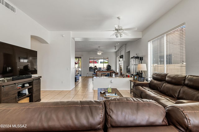 tiled living room featuring ceiling fan