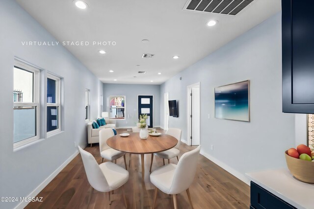 dining space featuring dark hardwood / wood-style flooring