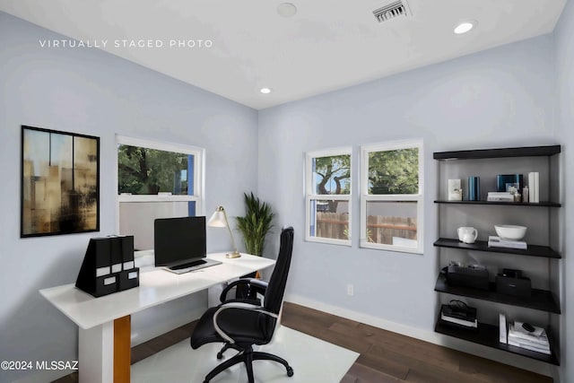 home office with dark hardwood / wood-style flooring