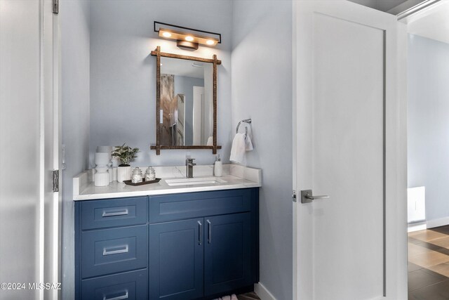 bathroom with tile patterned flooring and vanity