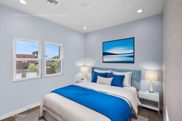 bedroom with hardwood / wood-style floors