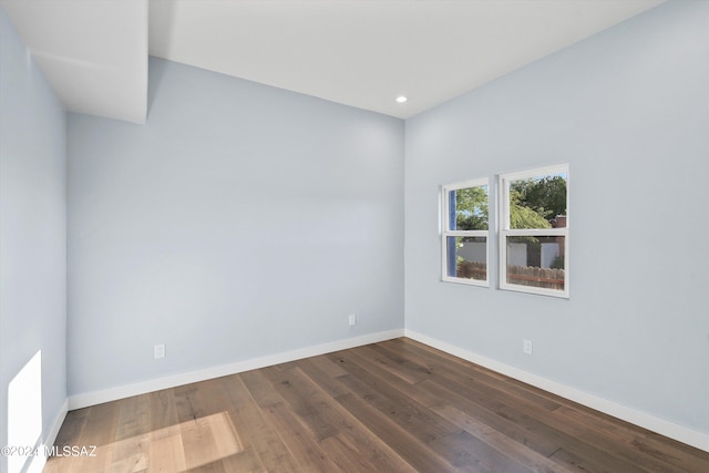 empty room featuring dark hardwood / wood-style floors