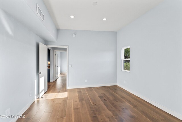 unfurnished room featuring hardwood / wood-style floors