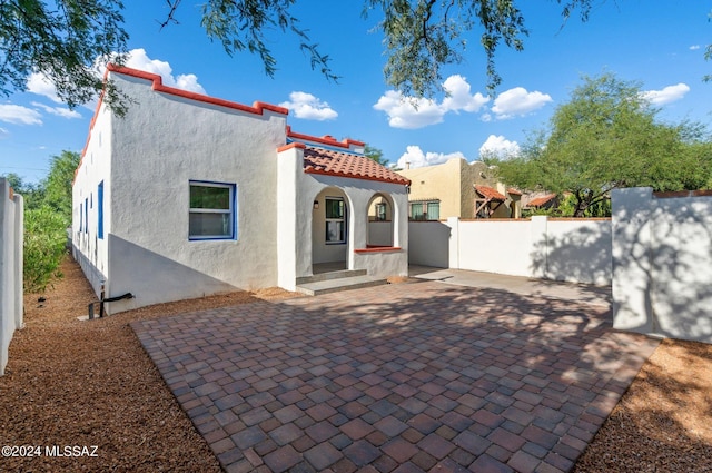 back of house with a patio area