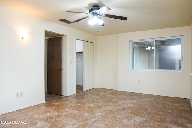 unfurnished bedroom with visible vents and ceiling fan