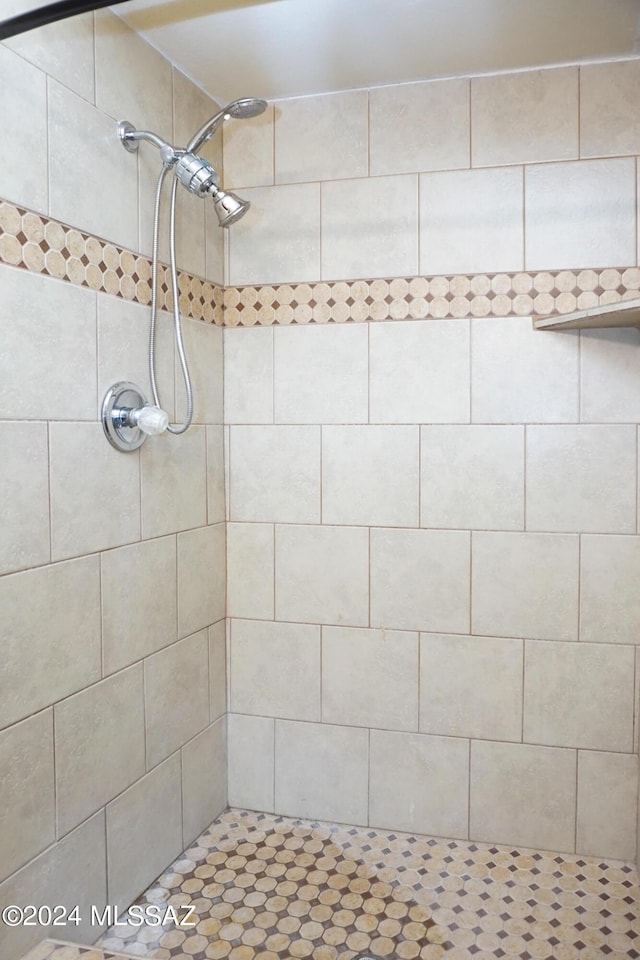 full bath featuring a tile shower