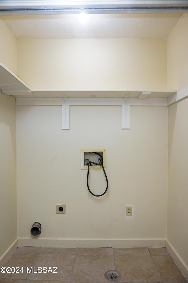 laundry area with electric dryer hookup, baseboards, hookup for a washing machine, and laundry area