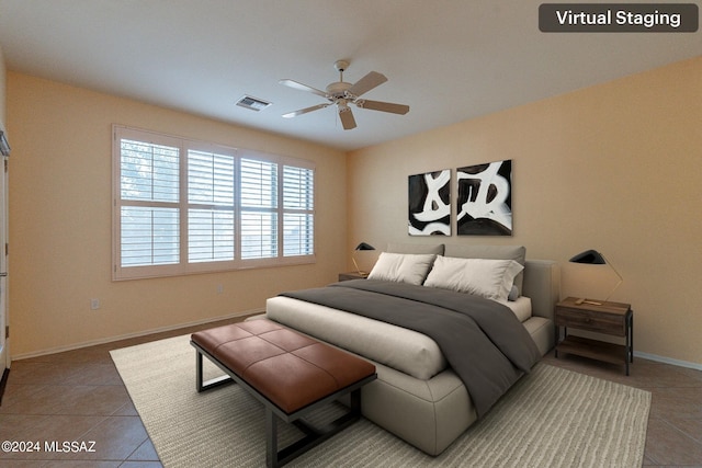 bedroom with tile patterned flooring and ceiling fan