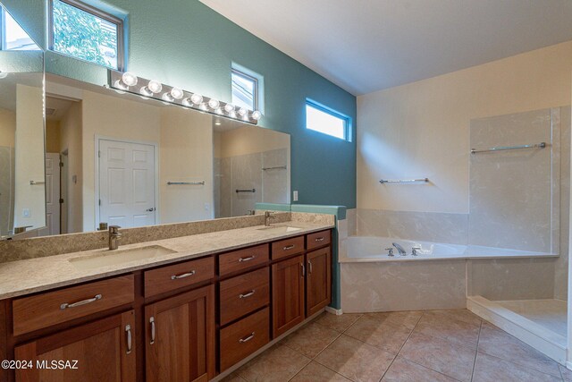 bathroom with vanity, shower with separate bathtub, and tile patterned floors