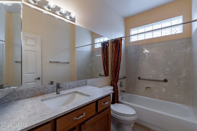 full bathroom with shower / bath combination with curtain, vanity, and toilet