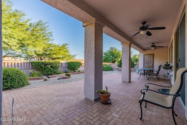 view of patio featuring ceiling fan