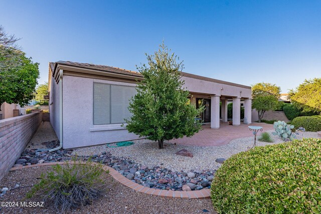 rear view of house featuring a patio