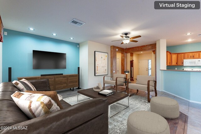 living room featuring ceiling fan