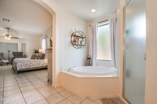 bathroom with independent shower and bath and a wealth of natural light