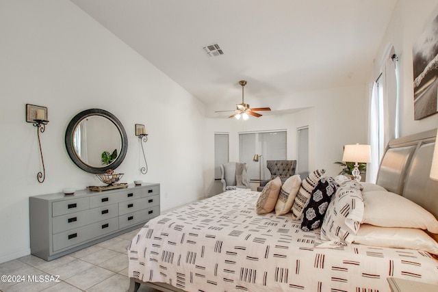 bedroom featuring light tile patterned floors and ceiling fan